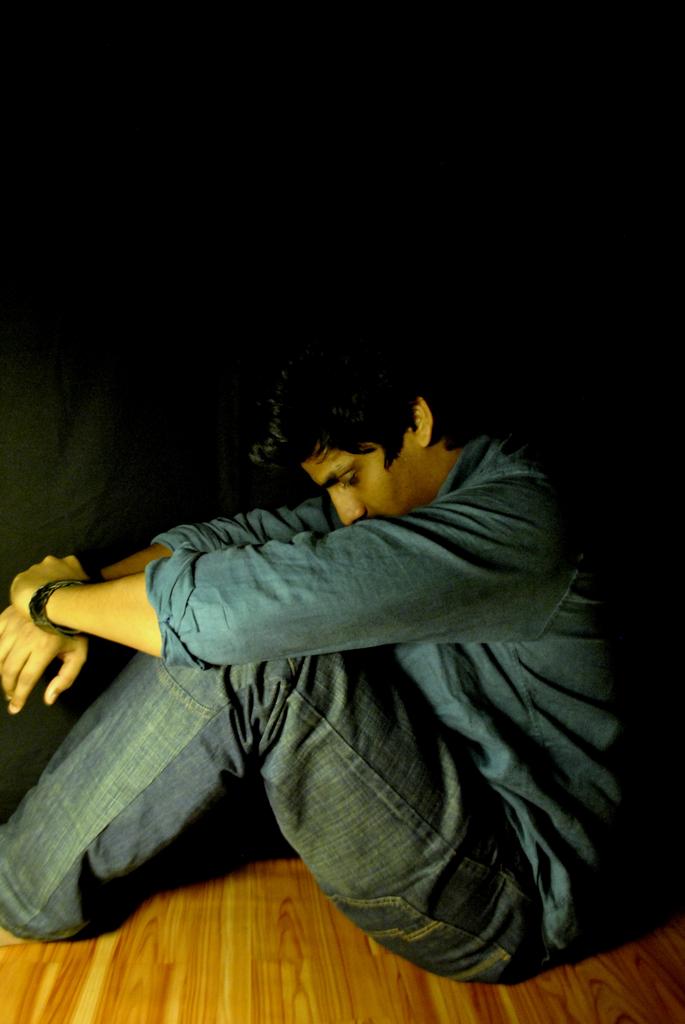 man_depressed_sad_sitting